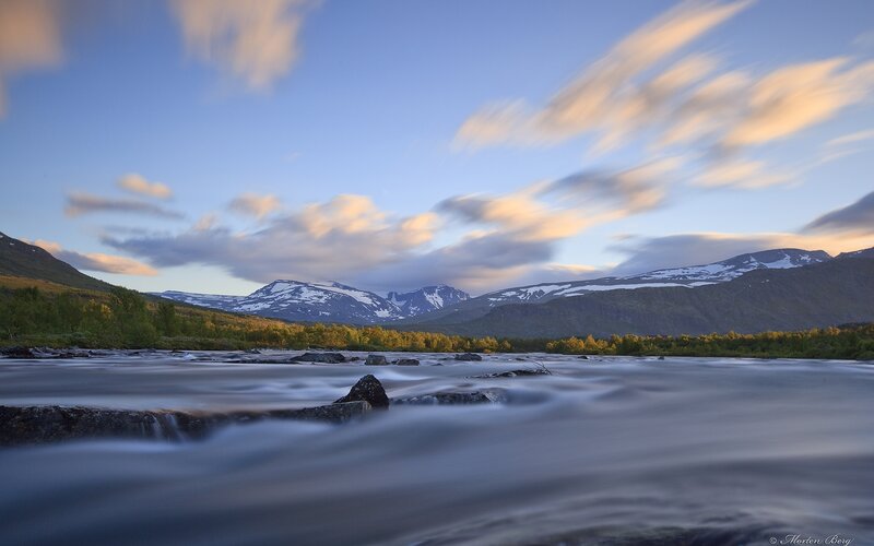River Flowing Through Mountains — Blue, Serene, Sunset, Photograph, Trees