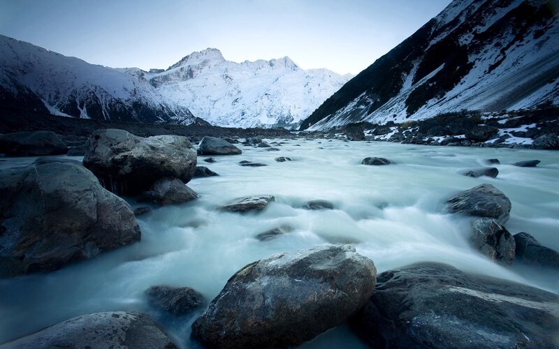 River Flowing Through Mountains — Blue, Serene, Winter, Photograph, Rocks