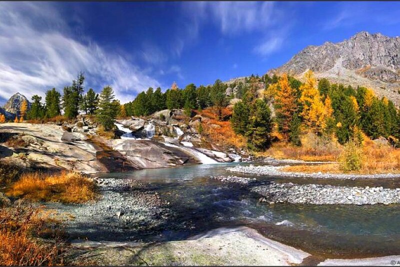 River Flowing Through Mountains — Blue