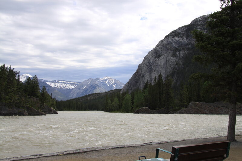 River Flowing Through Mountains — Gray