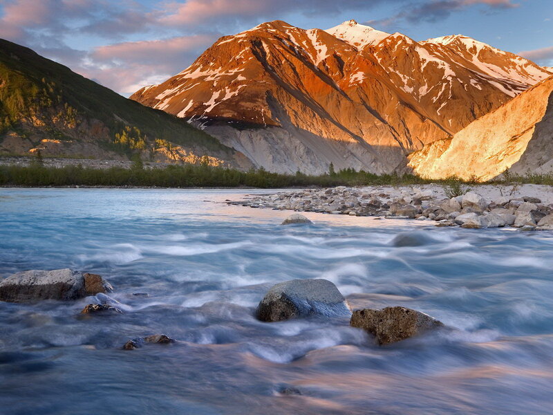 River Flowing Through Mountains — Sunset