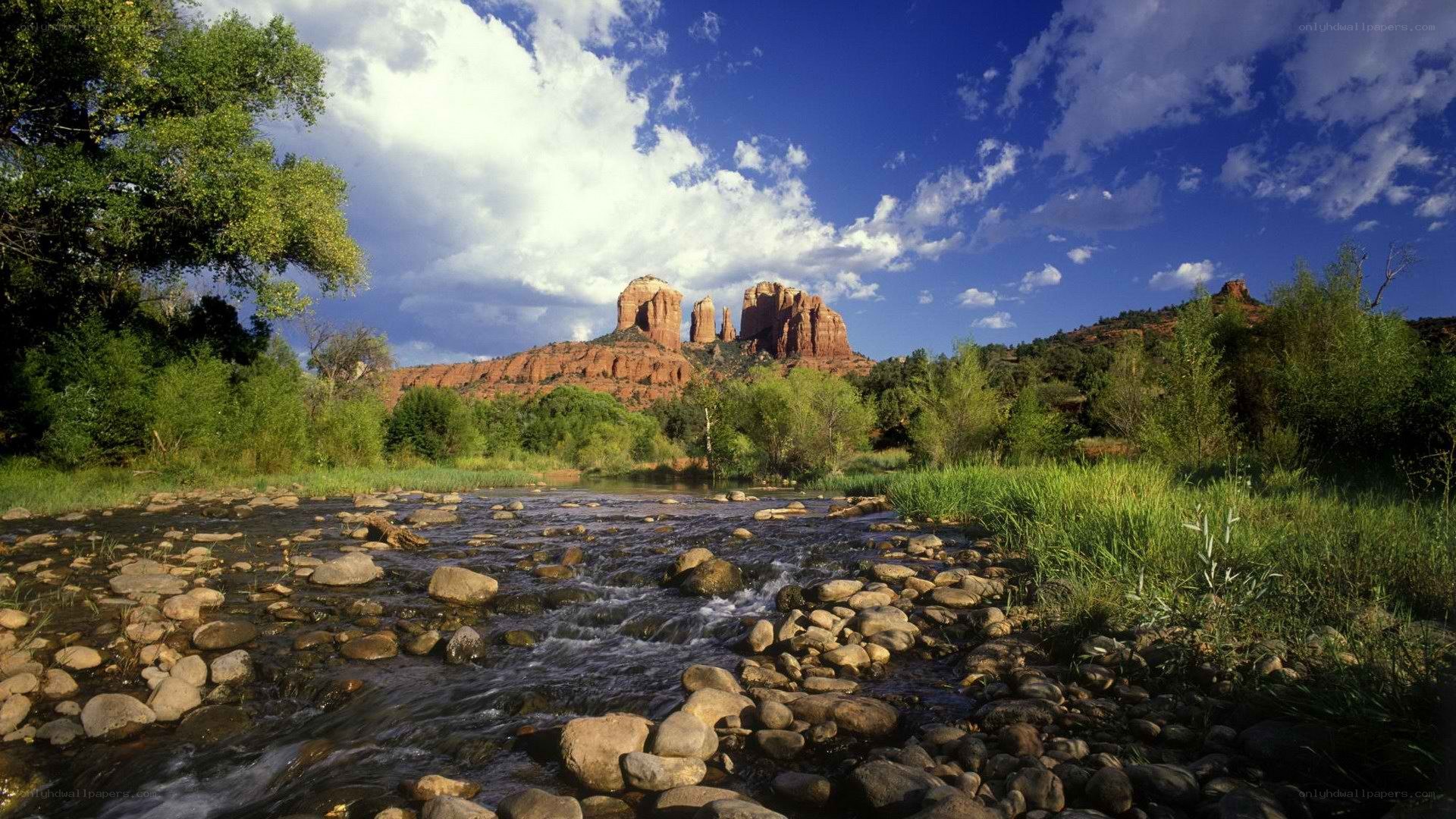River flowing through red rock canyon
