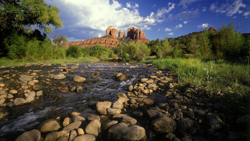 River flowing through red rock canyon