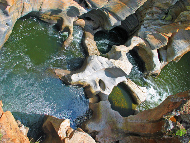 River Flowing Through Rock Formations — Green