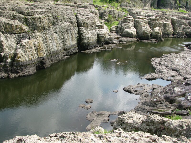 River Flowing Through Rock — Gray