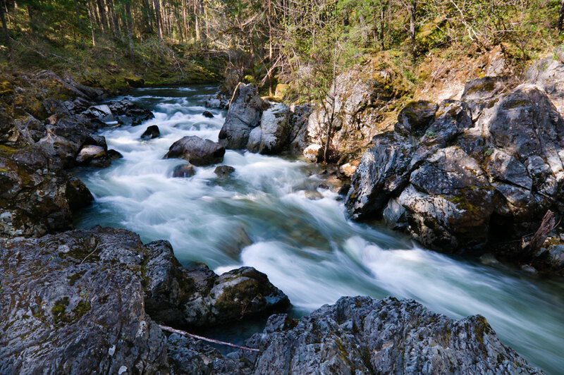 River Flowing Through Rocks — Blue, Serene, Afternoon
