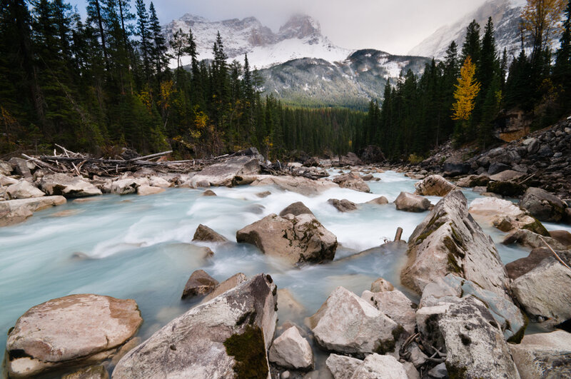 River Flowing Through Rocks — Blue, Serene, Autumn, Photograph