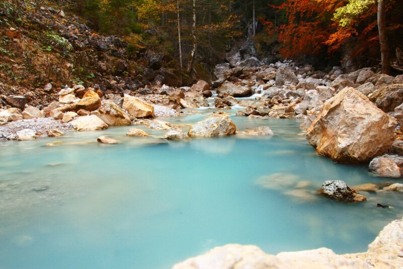 River Flowing Through Rocks — Blue, Serene, Autumn, Photograph, Trees