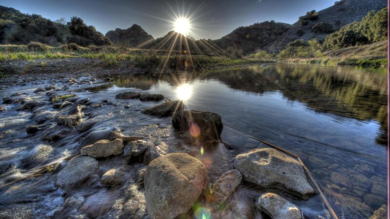 River Flowing Through Rocks — Blue, Serene, Sunset, Photograph
