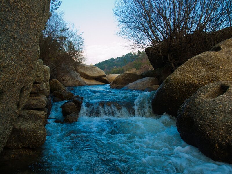 River Flowing Through Rocks — Blue, Serene, Sunset