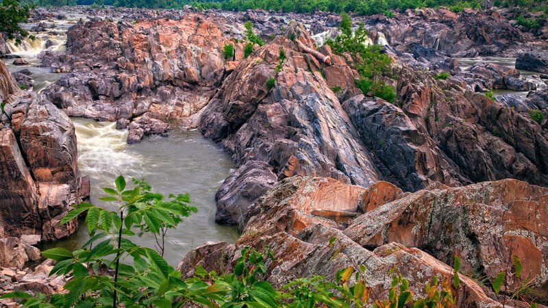 River Flowing Through Rocks — Brown