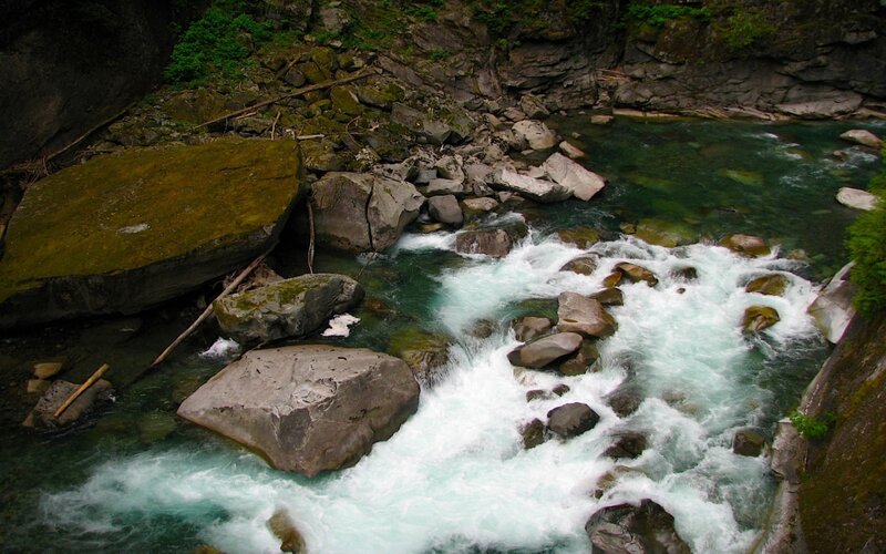 River Flowing Through Rocks — Green, Natural