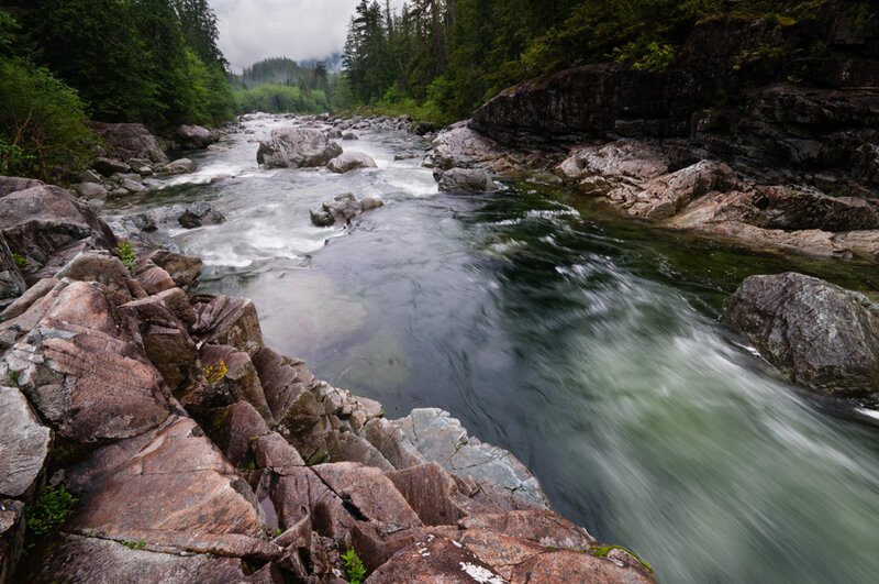 River Flowing Through Rocks — Green, Serene, Morning