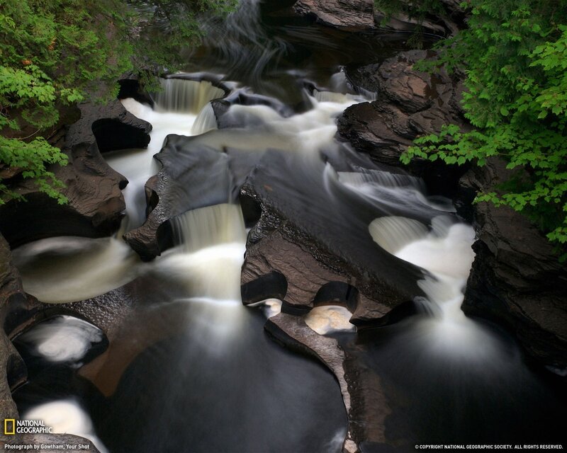River Flowing Through Rocks — Green, Serene, Photograph