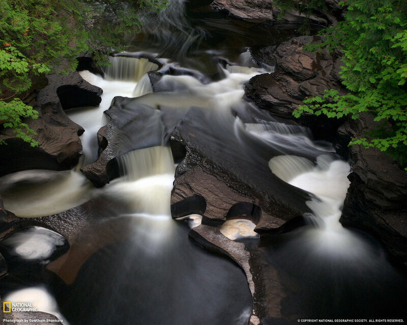River Flowing Through Rocks — Green