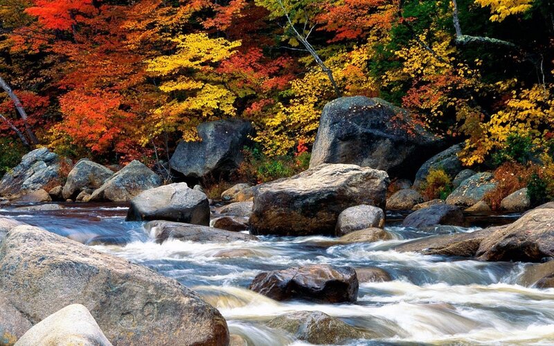 River Flowing Through Rocks — Red