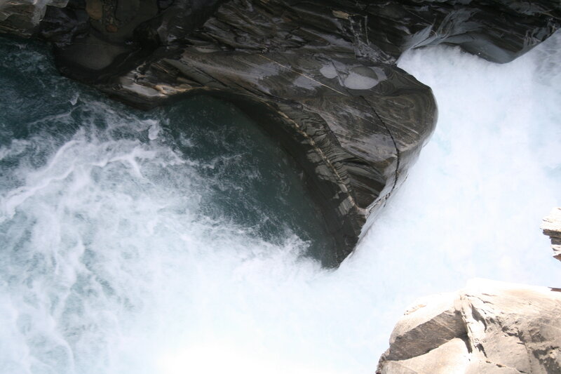 River Flowing Through Rocks — White
