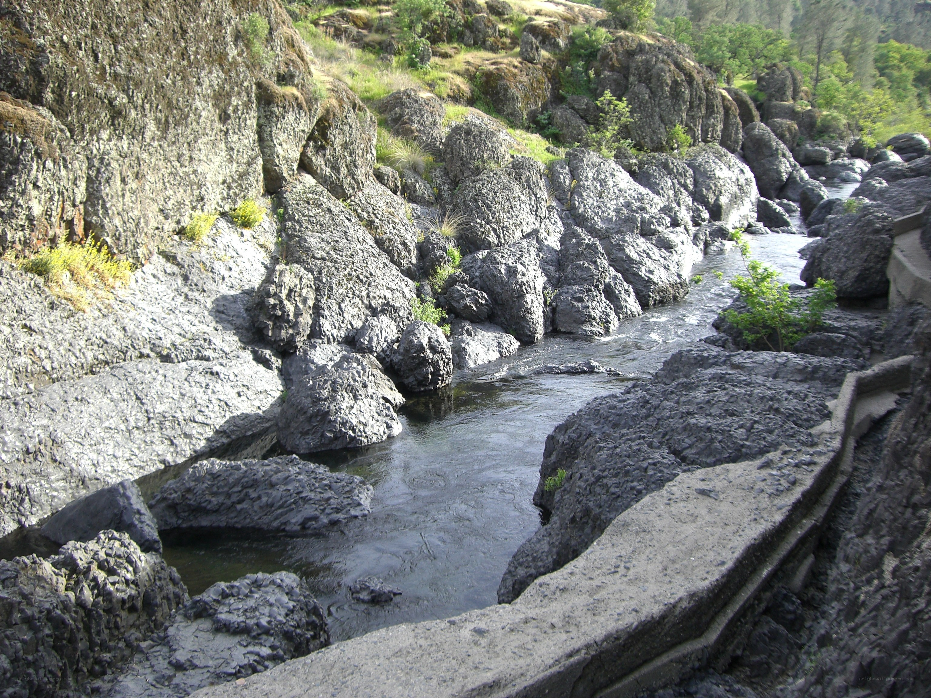 River flowing through rocky canyon