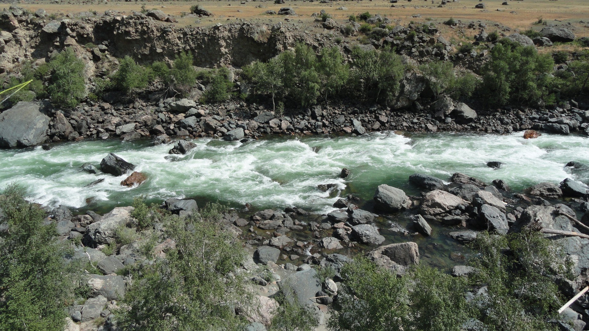 river flowing through rocky canyon