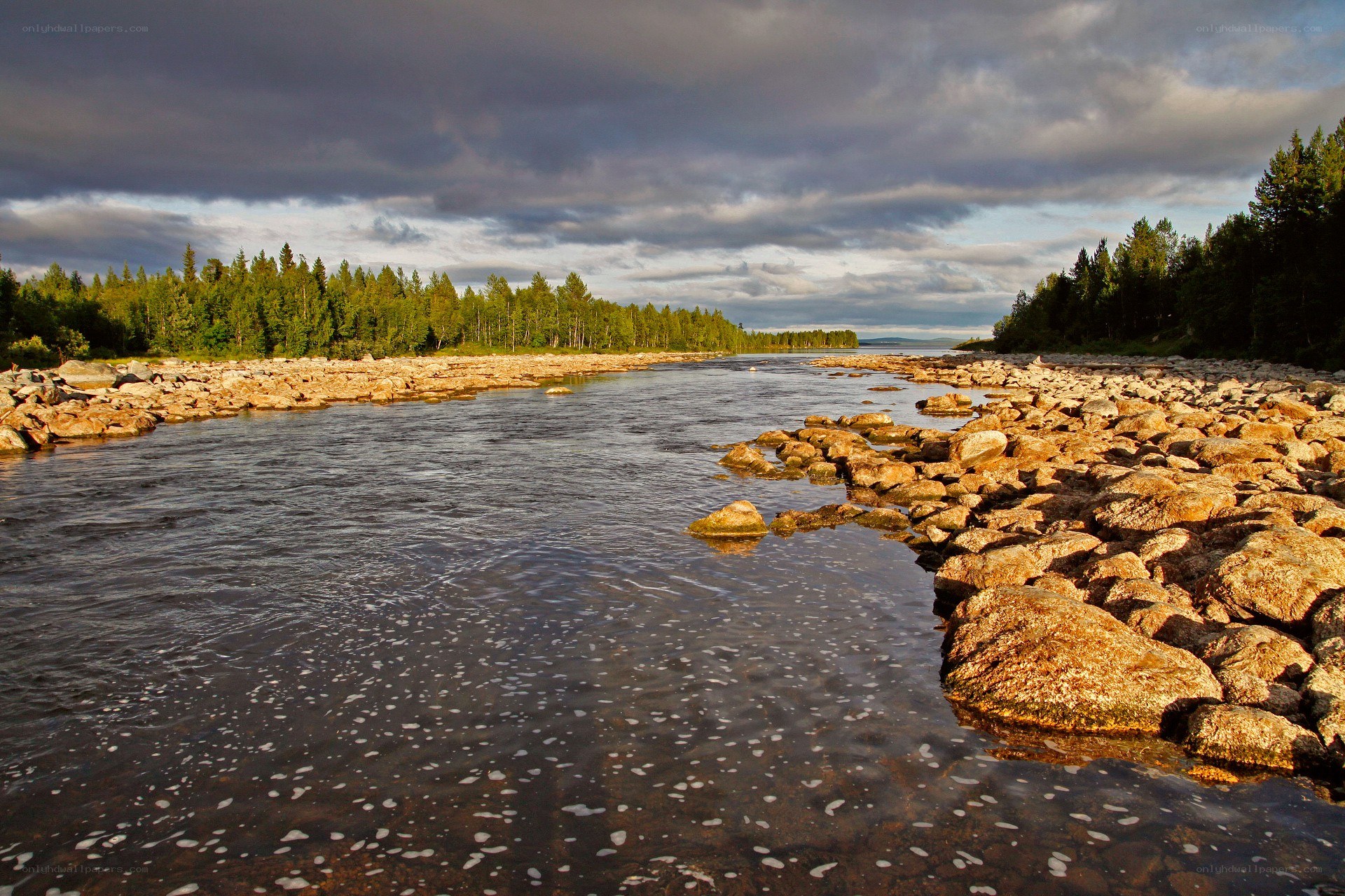 River flowing through rocky landscape