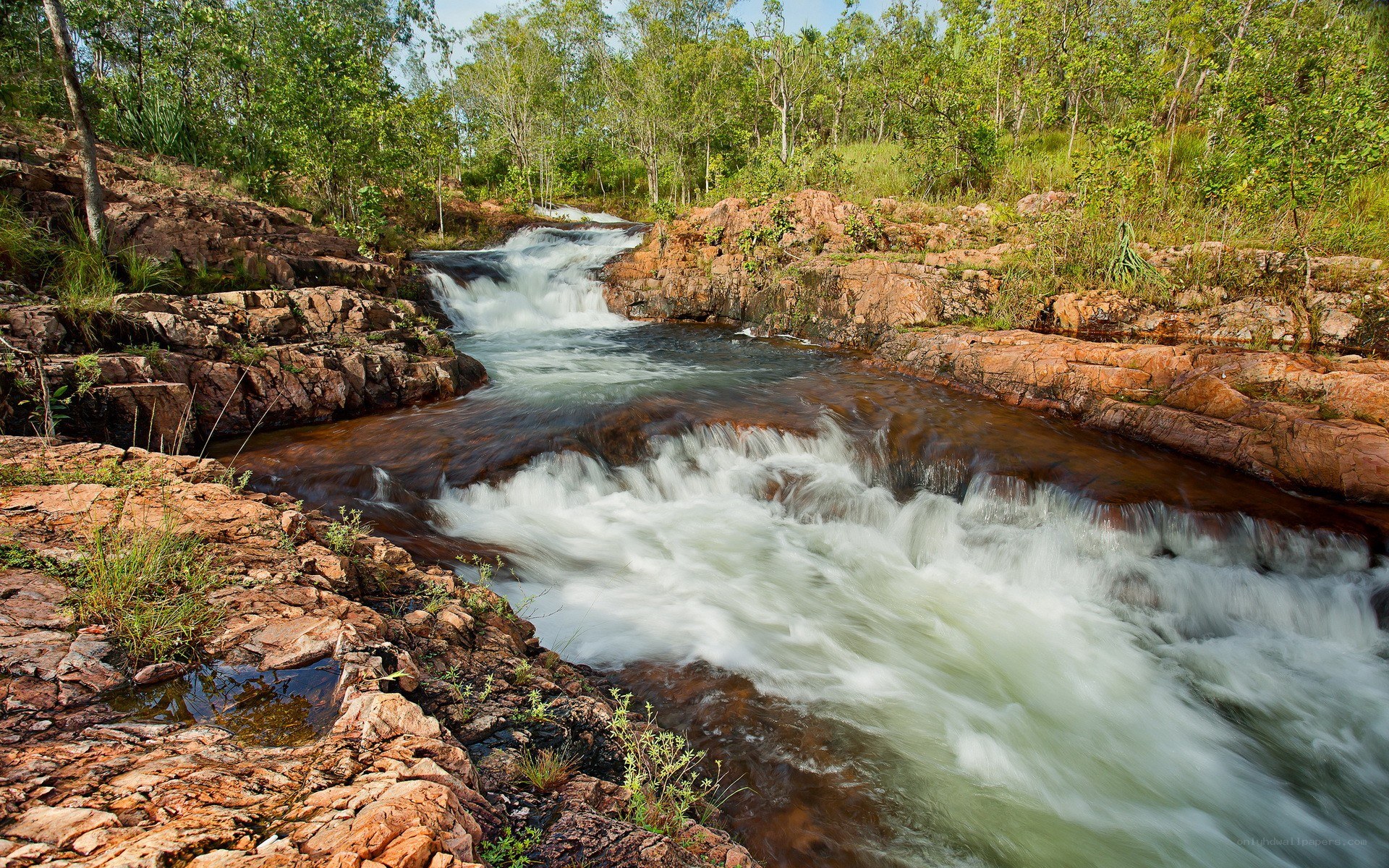River flowing through rocky landscape