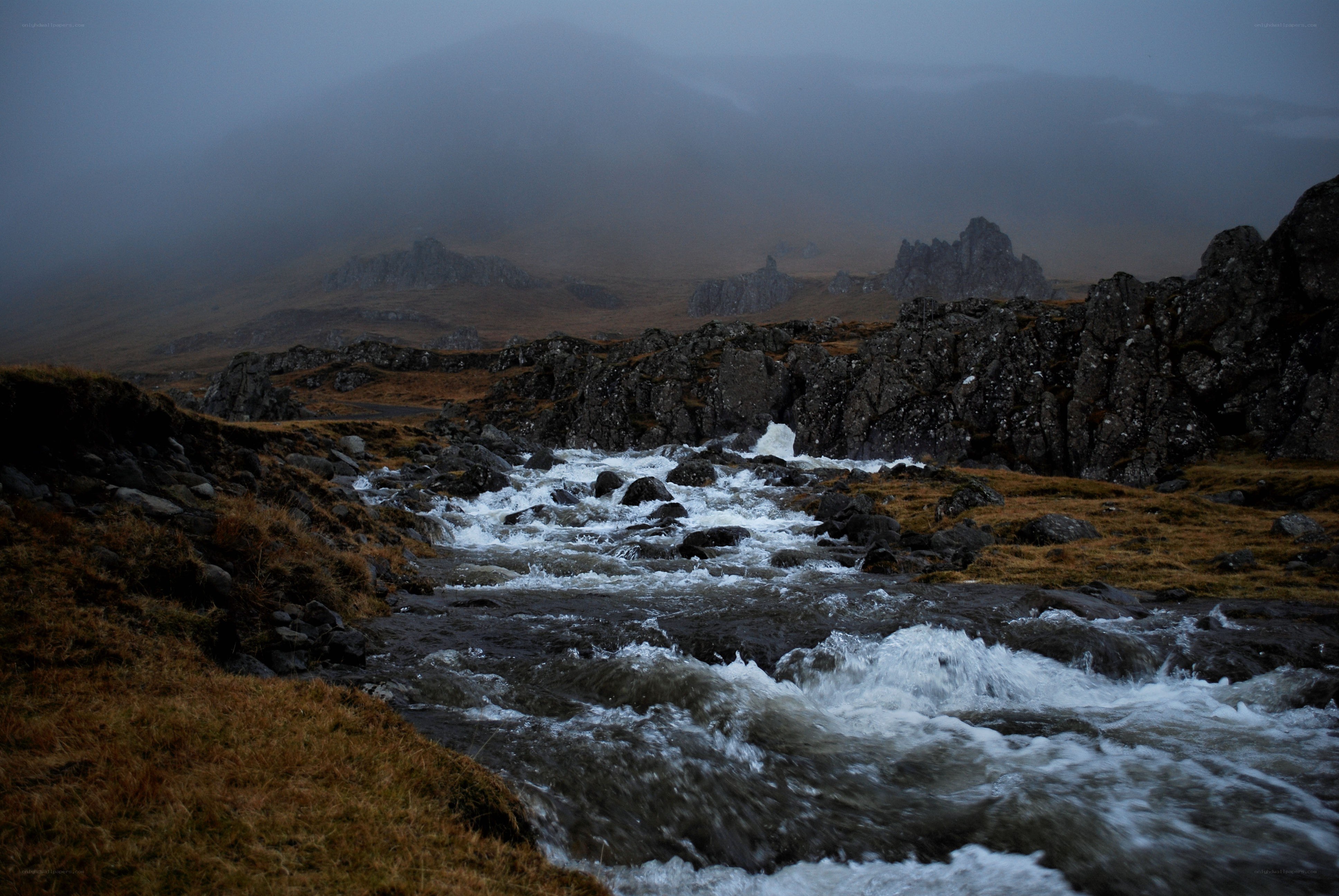 river flowing through rocky landscape