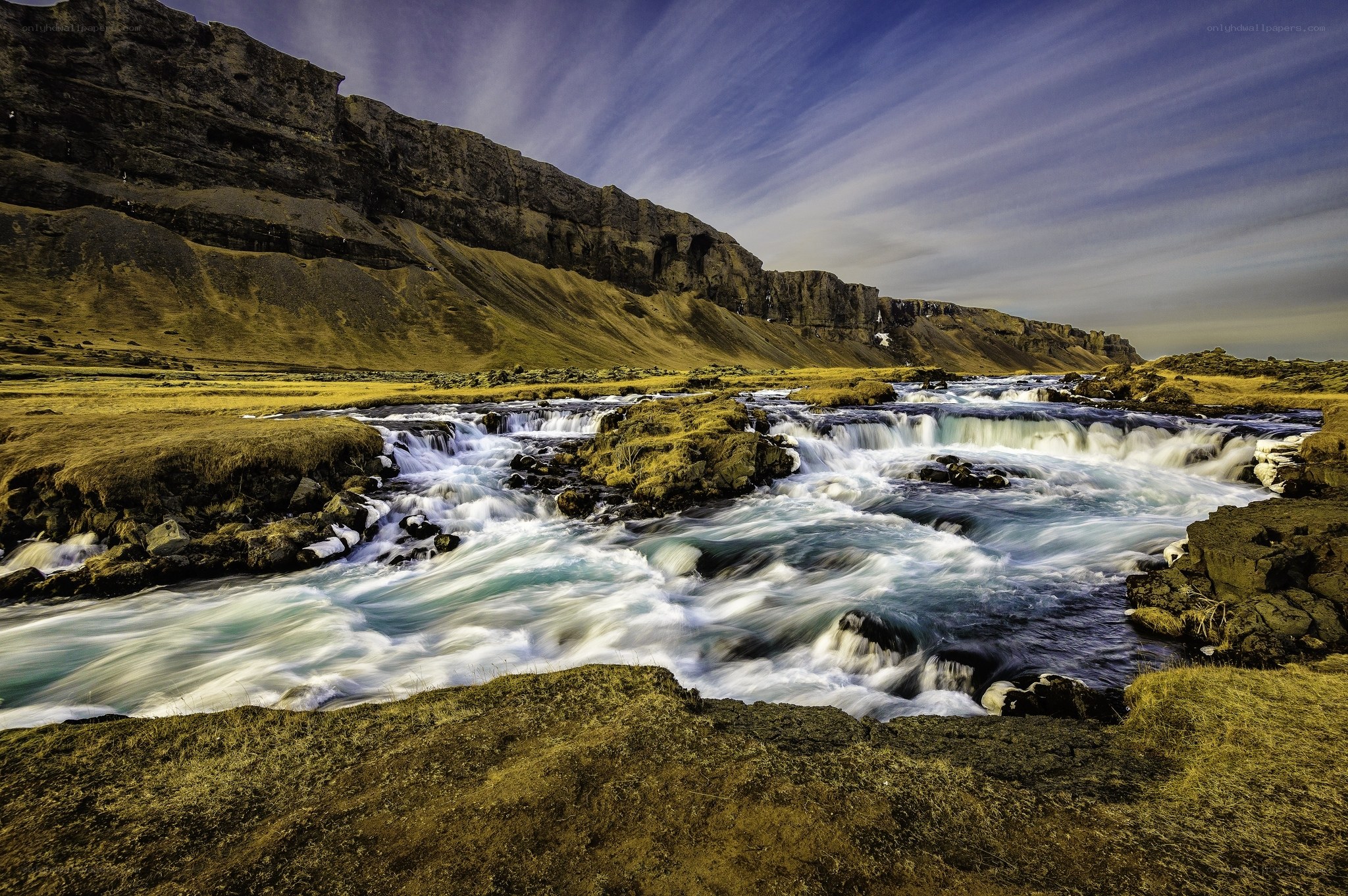 River flowing through rocky landscape