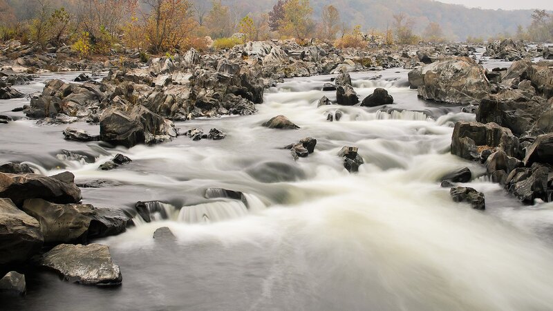 River flowing through rocky rapids
