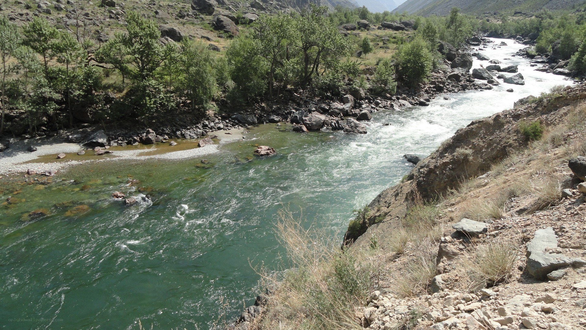 river flowing through rocky valley