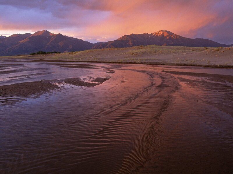 River Flowing Through Sand Dunes — Pink