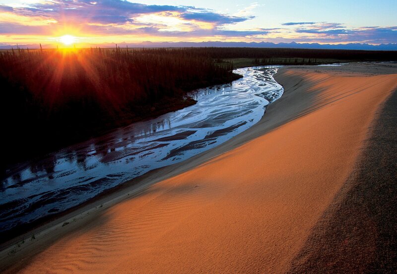 River Flowing Through Sand Dunes