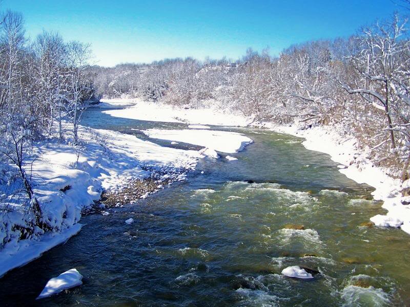 River Flowing Through Snow — Blue