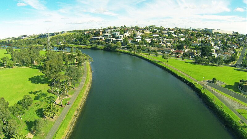 River Flowing Through Suburb