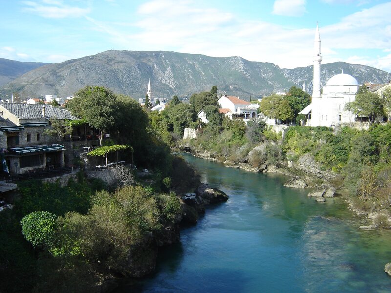 River Flowing Through Town — Blue, Serene, Afternoon