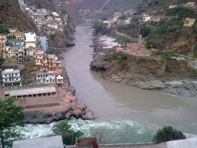 River Flowing Through Town — Brown