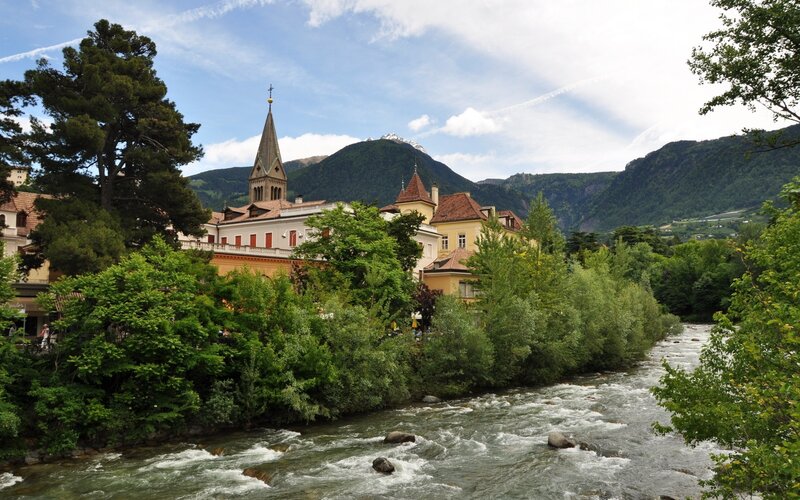 River Flowing Through Town — Green, Serene