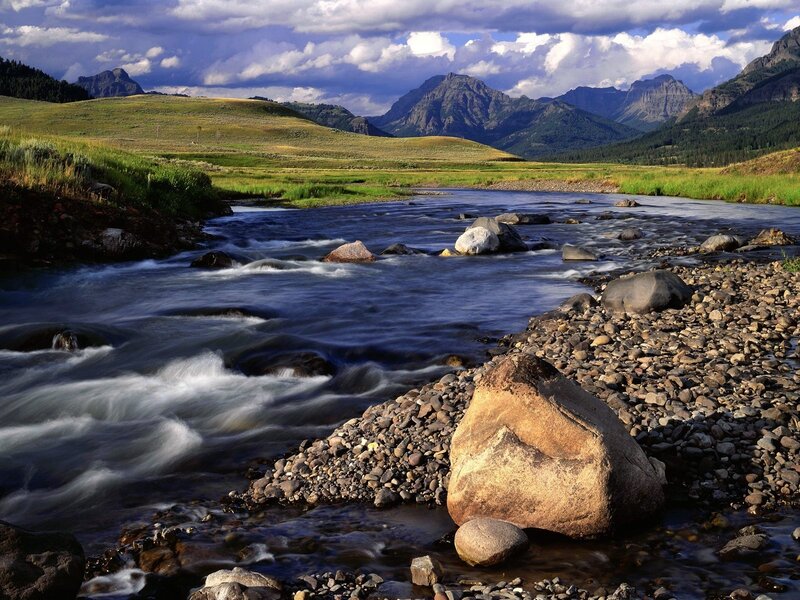 River Flowing Through Valley — Blue, Dramatic, Afternoon, Photograph