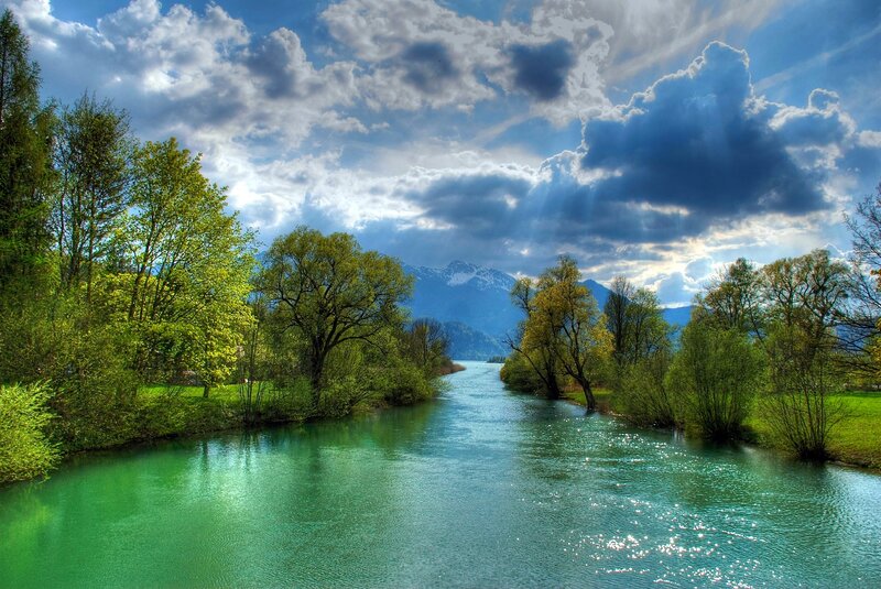 River Flowing Through Valley — Blue, Dramatic, Afternoon, Photograph, Trees