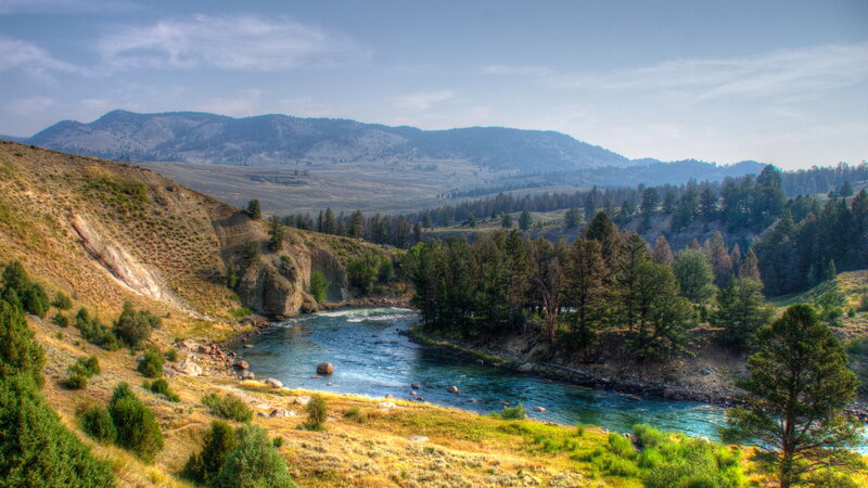 River Flowing Through Valley — Blue, Serene, Afternoon, Photograph, Mountains, Trees, Rocks