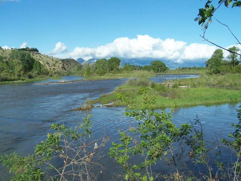 River Flowing Through Valley — Blue, Serene, Afternoon, Photograph