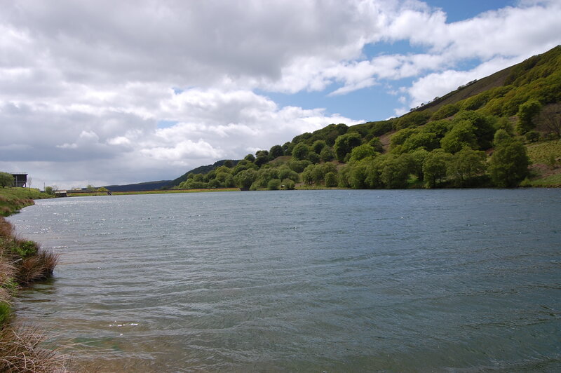 River Flowing Through Valley — Blue, Serene, Afternoon, Photograph, Trees, Hills, Clouds