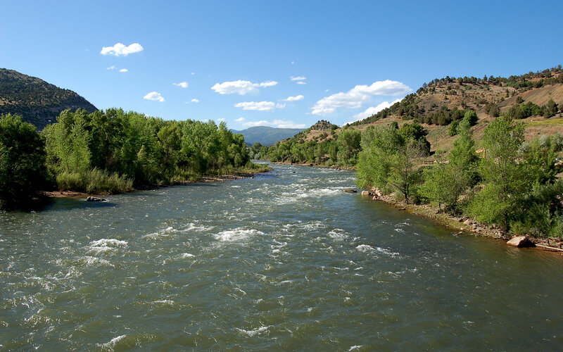 River Flowing Through Valley — Blue, Serene, Afternoon, Photograph, Trees