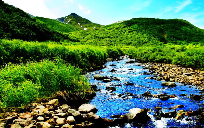River Flowing Through Valley — Blue, Serene, Summer