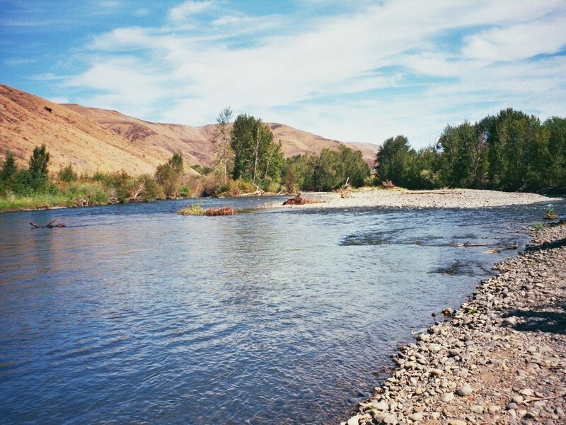 River Flowing Through Valley — Blue