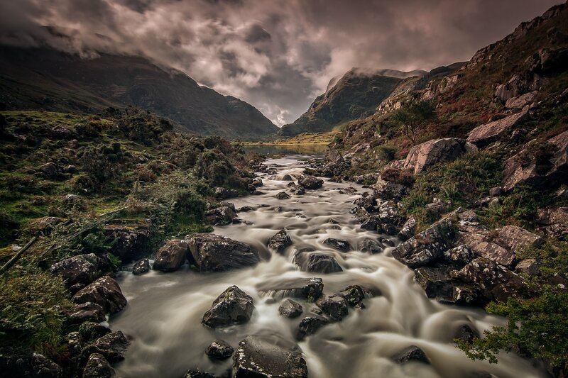 River Flowing Through Valley — Gray, Dramatic