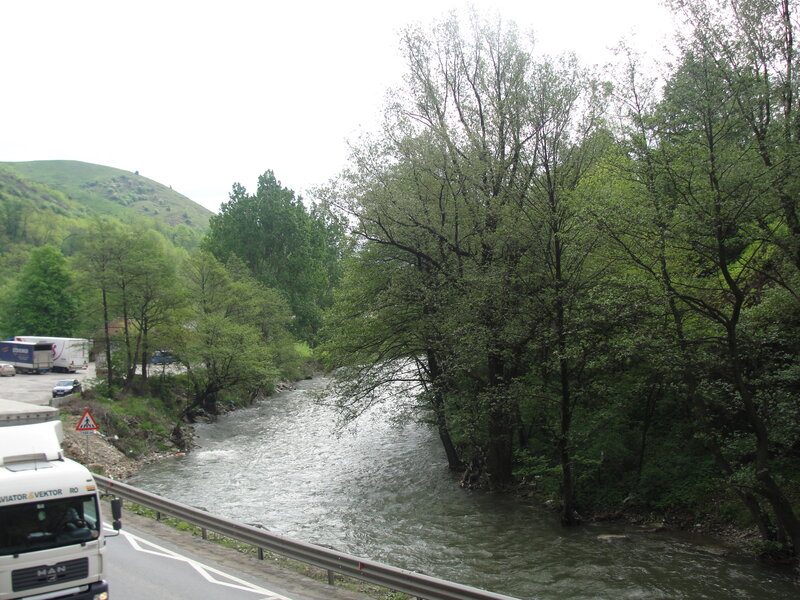 River Flowing Through Valley — Green, Calm