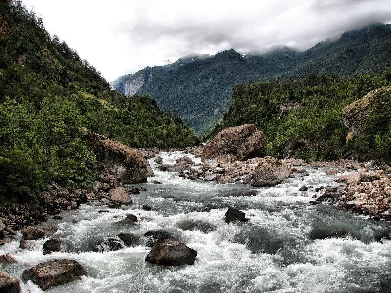 River Flowing Through Valley — Green, Dramatic, Photograph