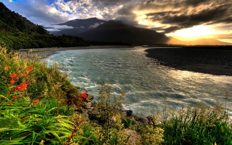 River Flowing Through Valley — Green, Dramatic