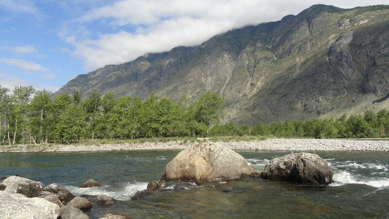 River Flowing Through Valley — Green, Serene, Afternoon, Photograph, Mountain, Trees, Rocks