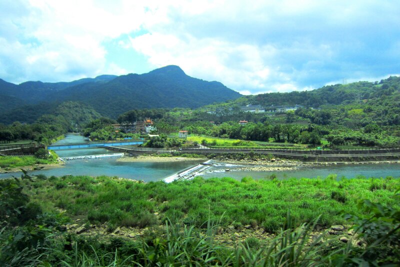 River Flowing Through Valley — Green, Serene, Afternoon, Photograph, Mountains